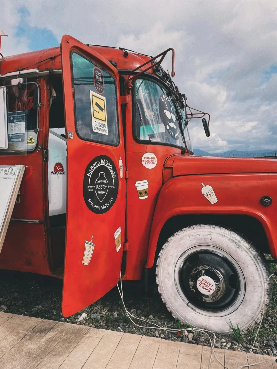 a truck with a menu sitting on the side of it