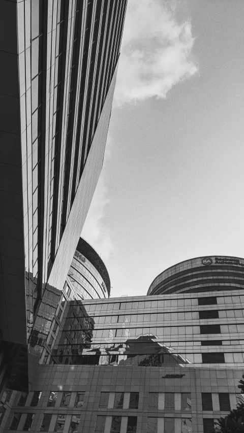 the reflection of a building and skyscrs in an urban setting