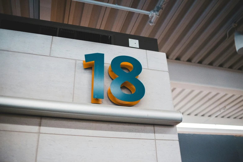 a modern building with the number eighteen displayed on it