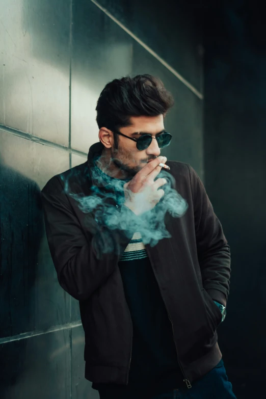 a man in black jacket smoking a cigarette