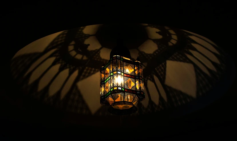 the shadow of a light fixture against the ceiling