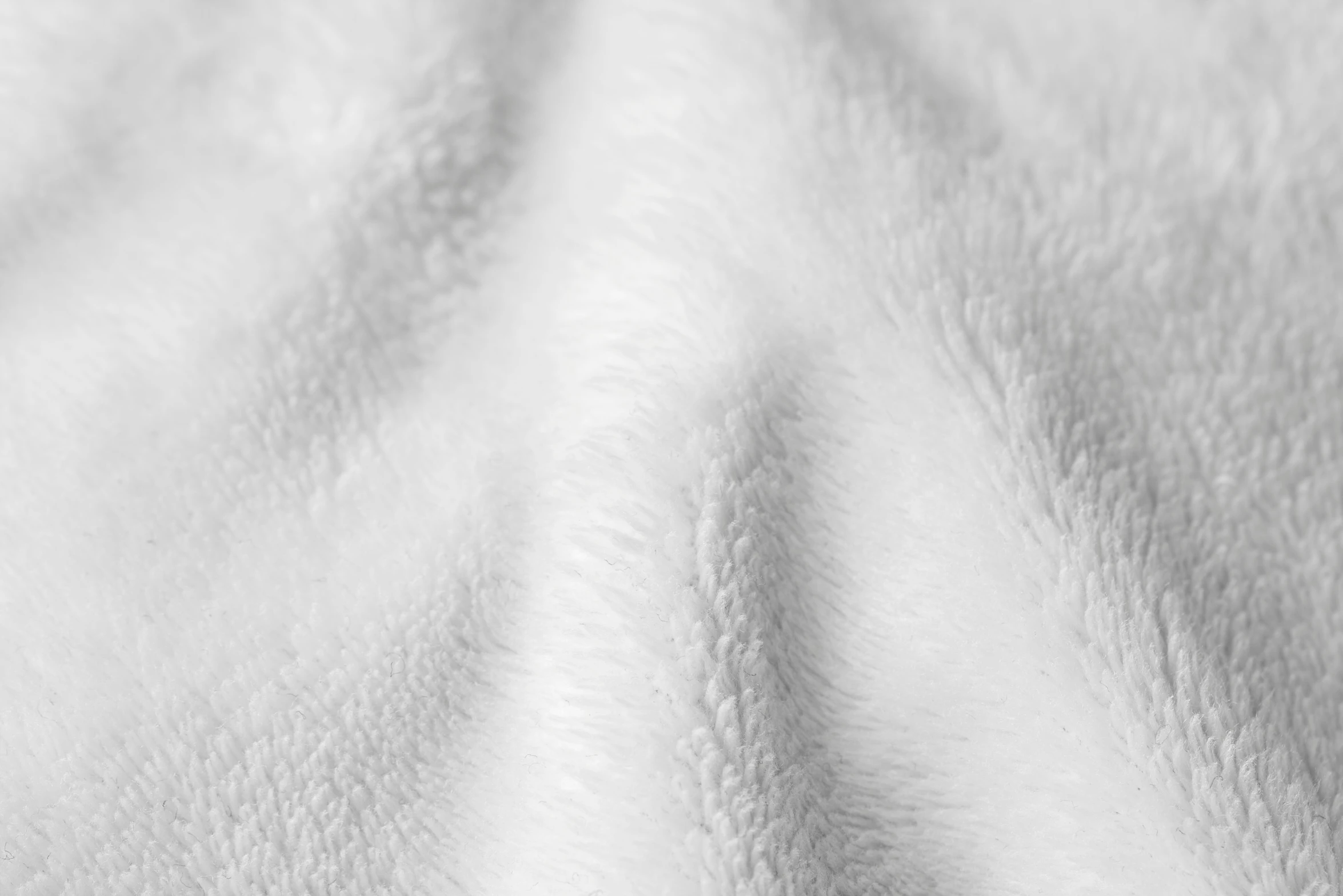 a white sheet textured with a pattern