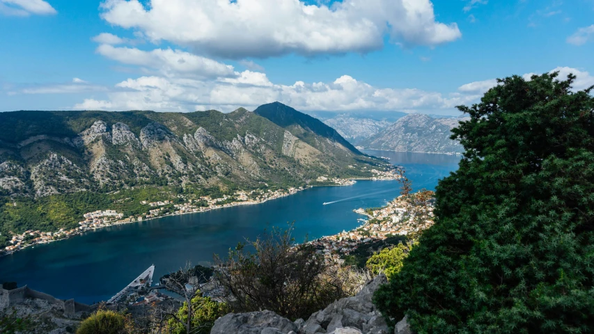 a scenic view over the water and mountains in an island