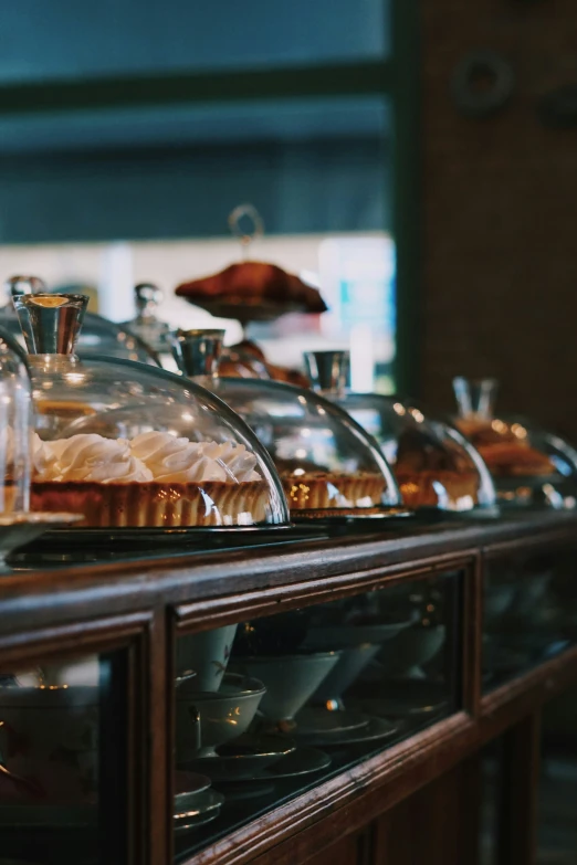 a couple of tables covered with trays filled with food