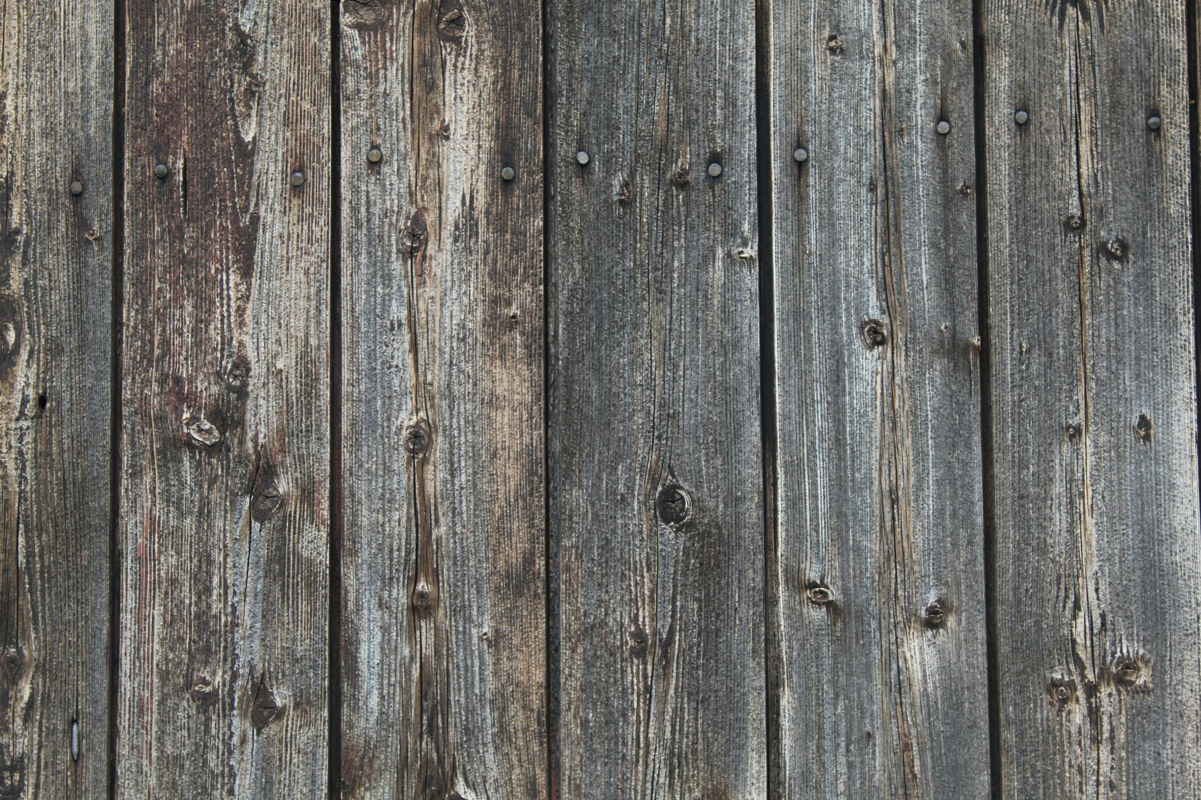 a old wooden plank wall with a faded wood