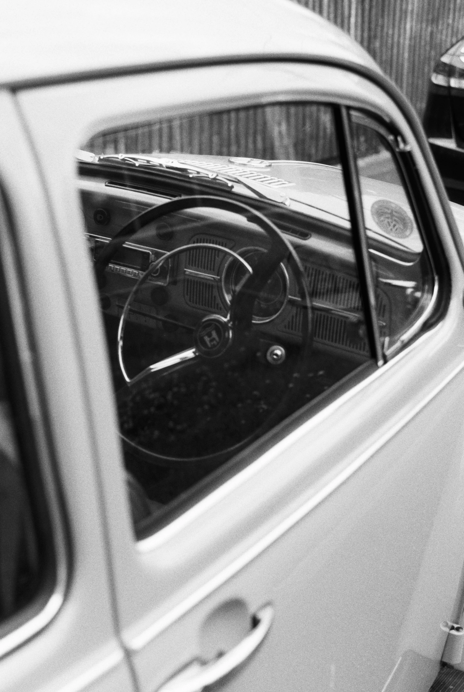 a car with the steering wheel visible through the windshield