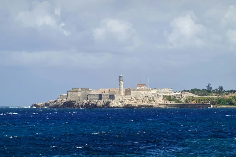 the view of a small island in the middle of the ocean