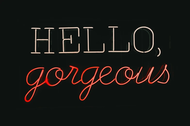 an illuminated neon sign that says hello gorgeous