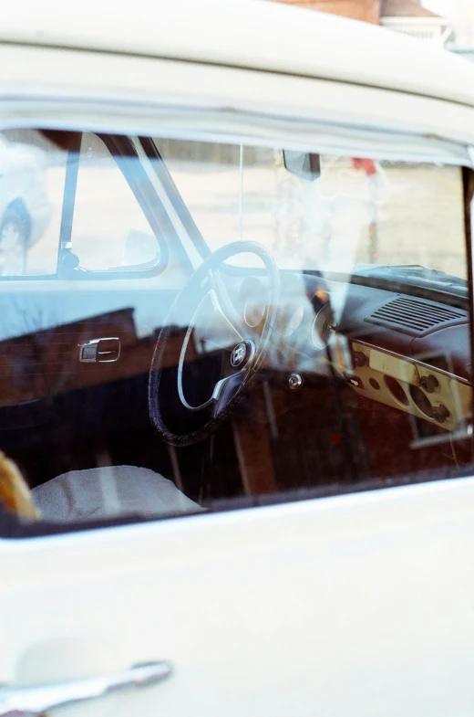 a reflection of a man inside of a car