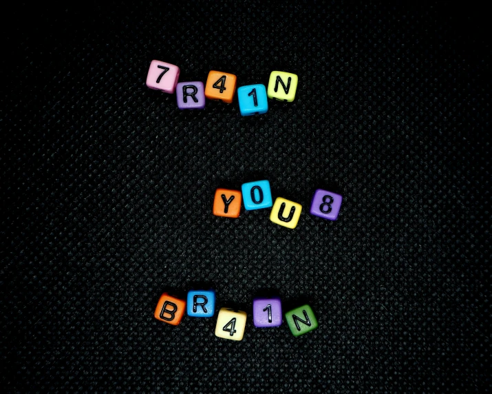 some letters that read learn in train and are colorful