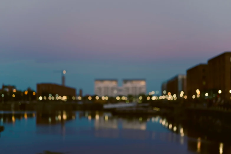 blurry city at night from across the river