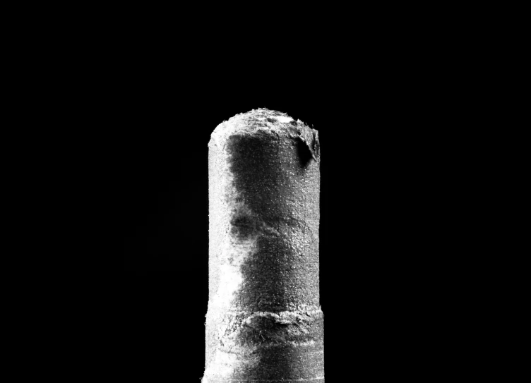 there is a black and white image of a long tube of soap