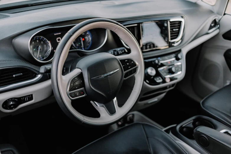 interior of a car with the steering wheel and dash board