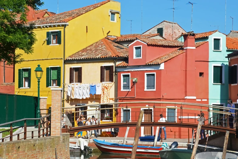 many colorful buildings next to a body of water