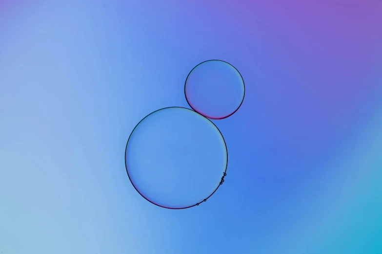 a circular object is being shown on a blue and purple background