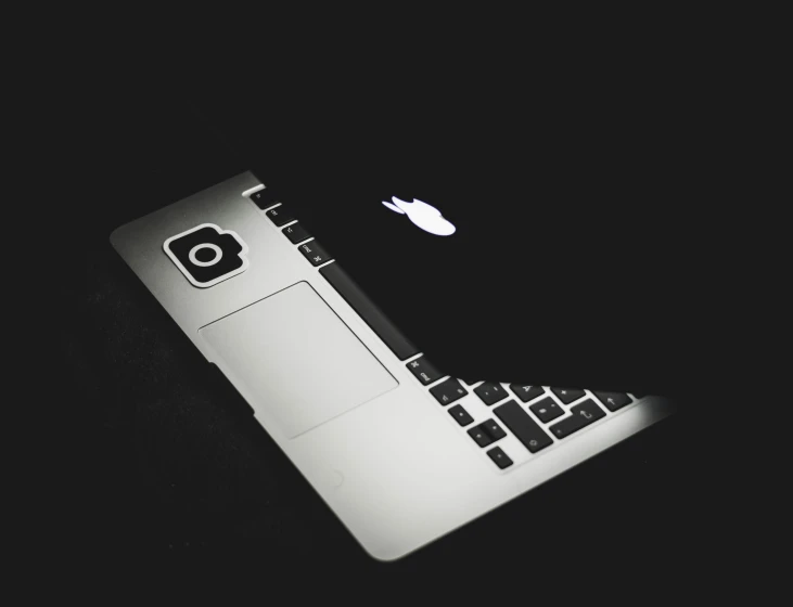 a laptop computer is sitting on the ground