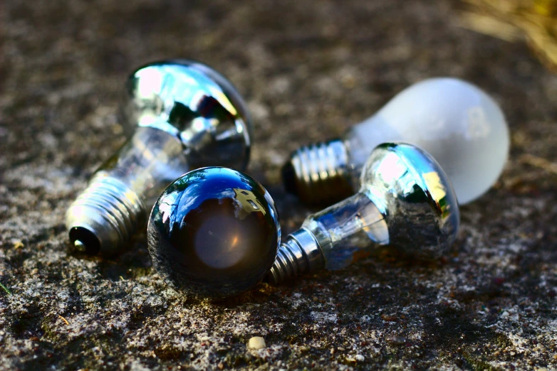 a pair of nails sitting on top of a street