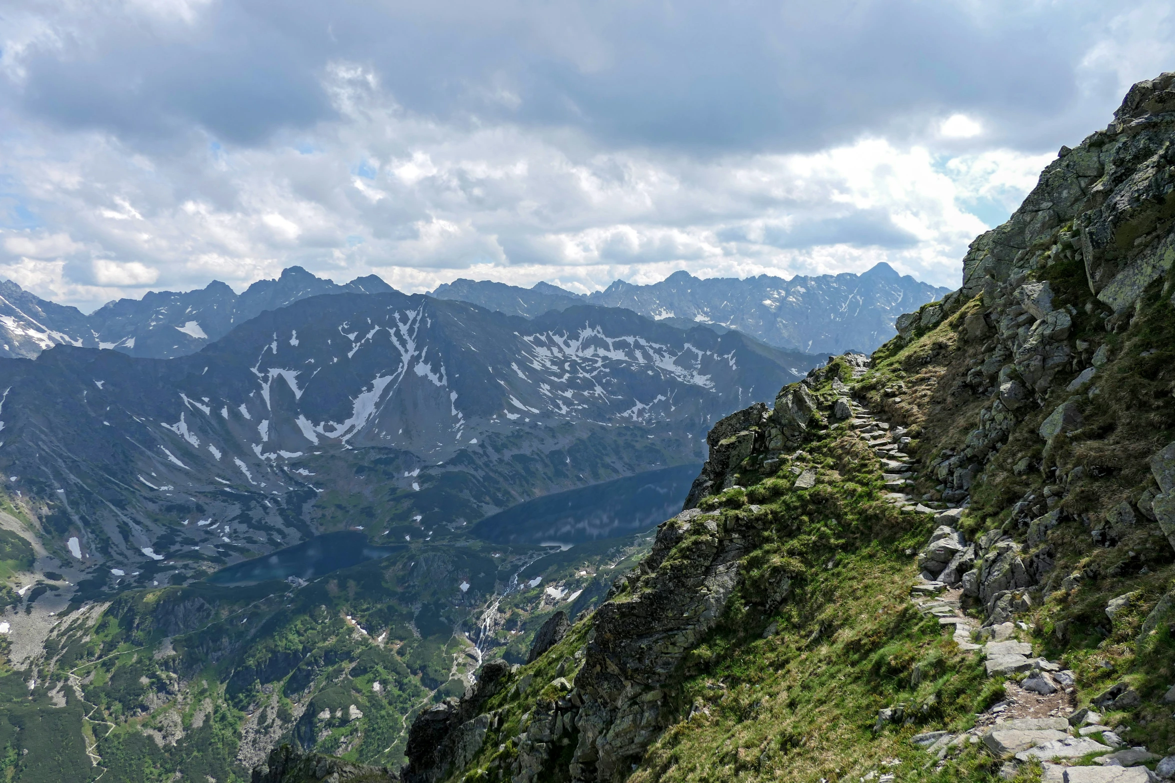 a view of a mountain with a group of rocks on top