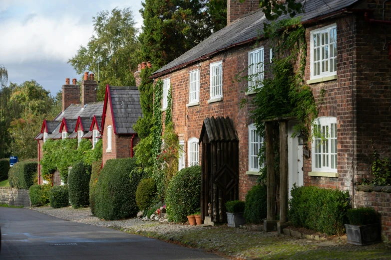 a row of brick cottages sitting next to each other