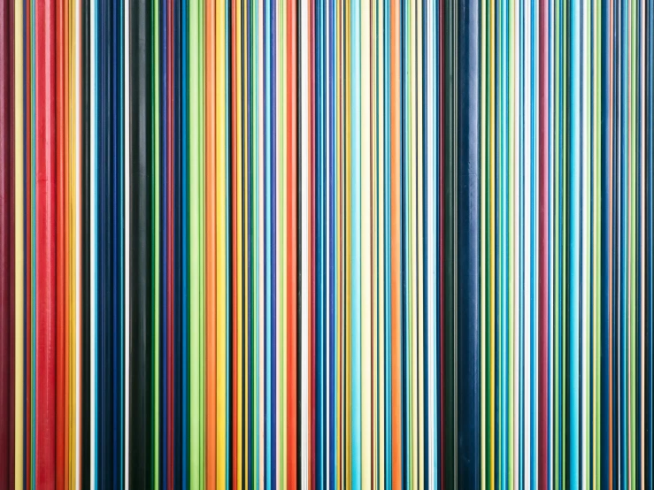 a wall of multicolored strips of material