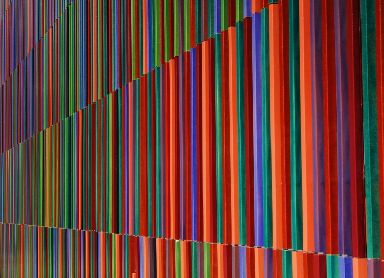 a large rainbow colored wall with vertical stripes