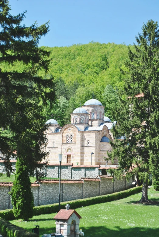 a church with mountains in the background