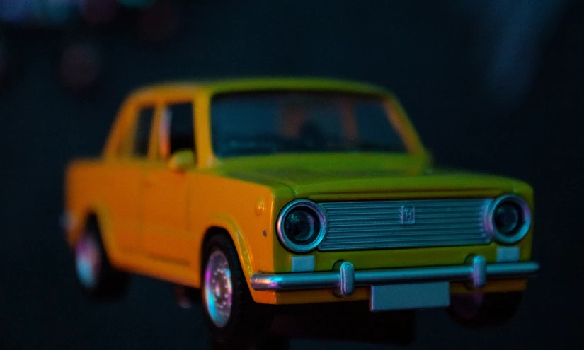 a close up s of a yellow car toy