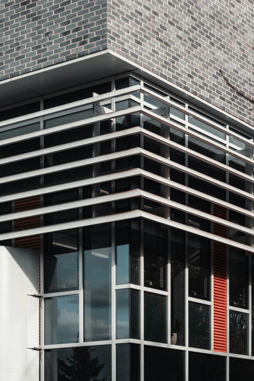 two red doors on the side of a grey building