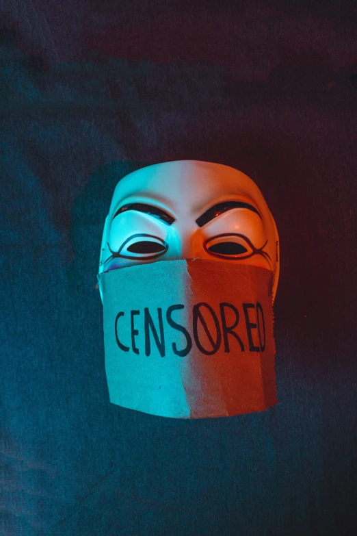 someone wearing a fake mask with the word censsore