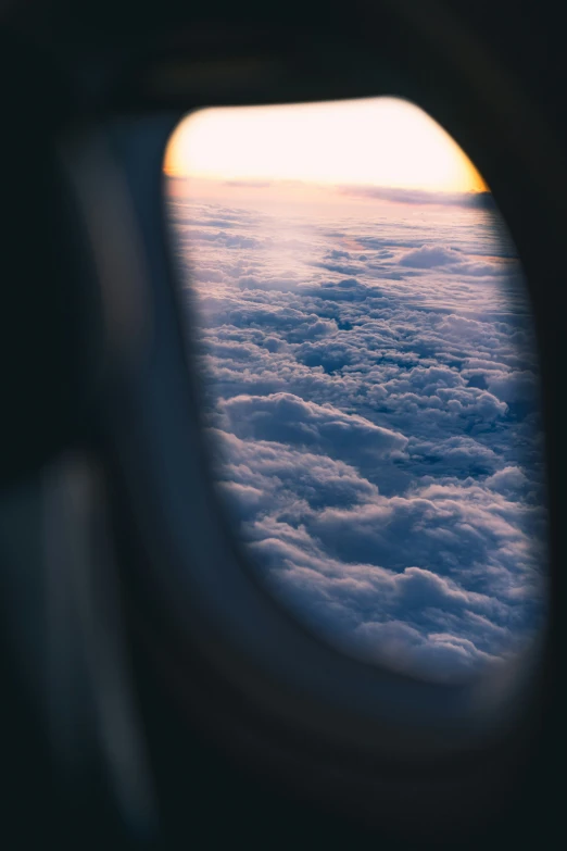 the wing of an airplane as seen from above the clouds