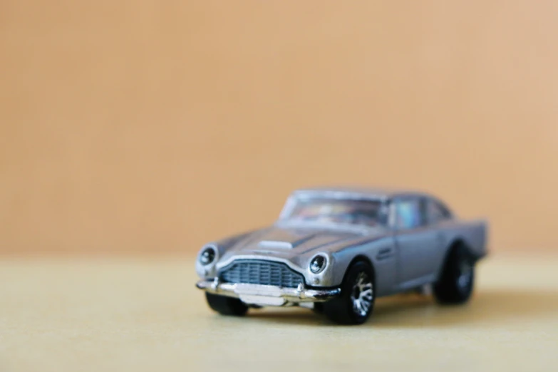 a gray toy car on a table