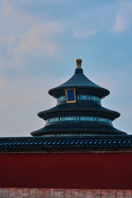 looking up at a tall tower with sky background