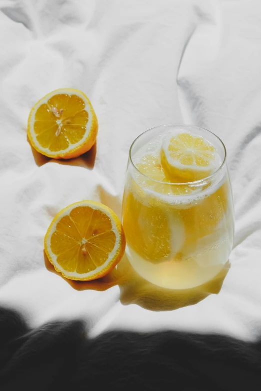 some sliced lemons on top of a glass