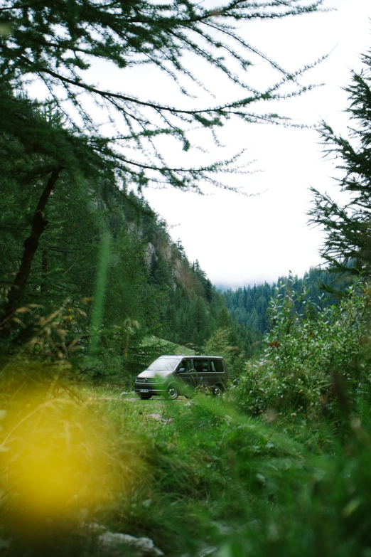 a van is driving on the side of a road