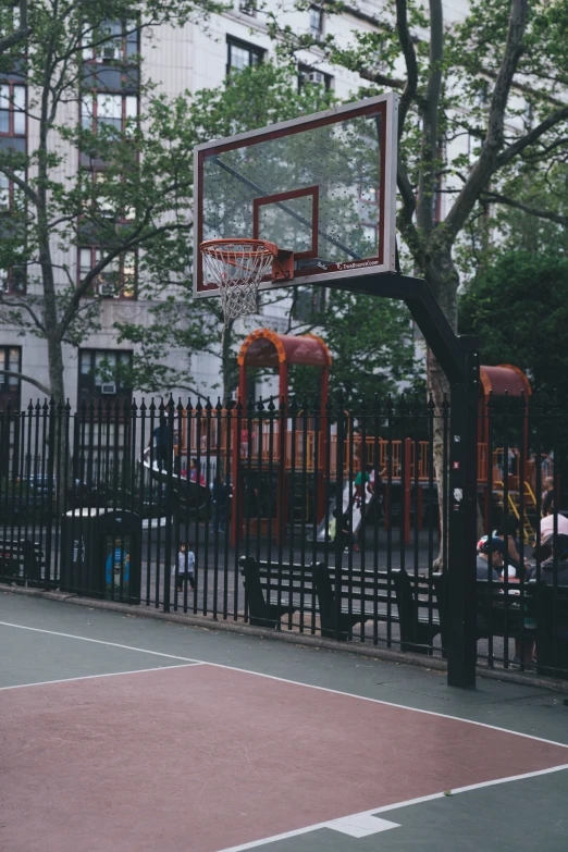 a basketball hoop over the backboard of an outdoor park