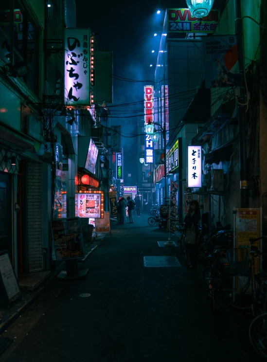 a dark city street with neon signs and people walking down it