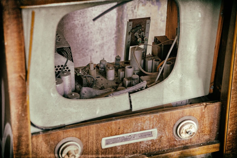 an old tv sitting on top of a wooden desk