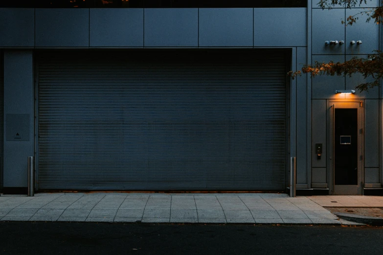 a po of a dark, empty street and door