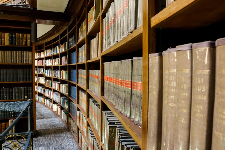 a bunch of books in a liry on a shelf