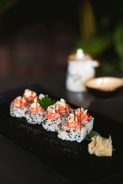 sushi served with seaweed and vegetables and dipping sauce