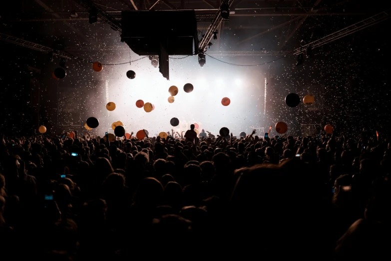 a concert with a large crowd in front of it