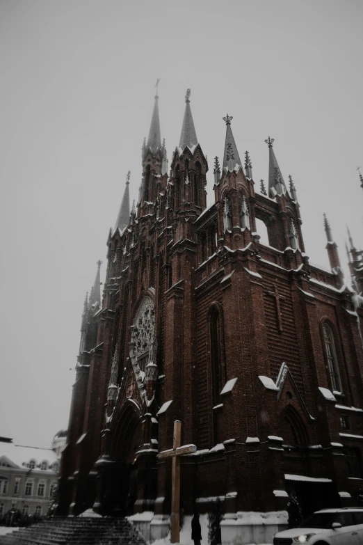 a clock tower in the middle of a snowy city