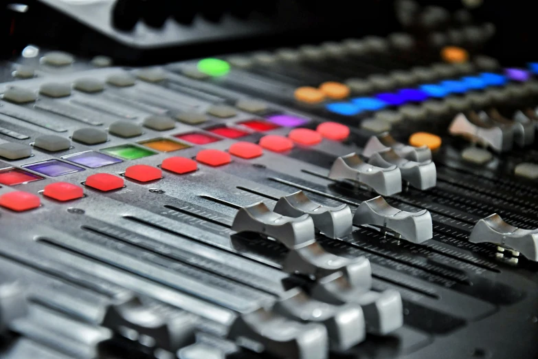 mixing console with various controls and sound board