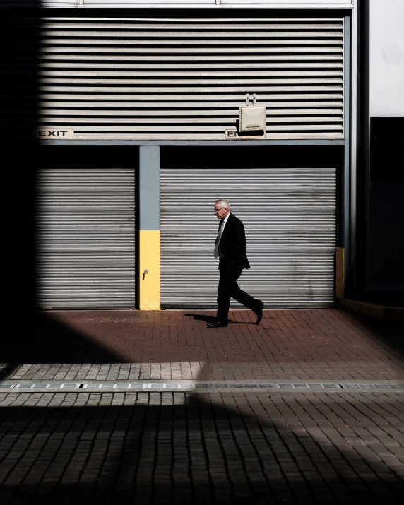 a man walking down the street during the day