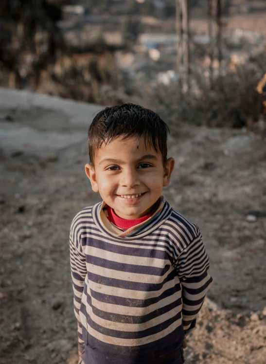 a child stands with a tooth on it's face