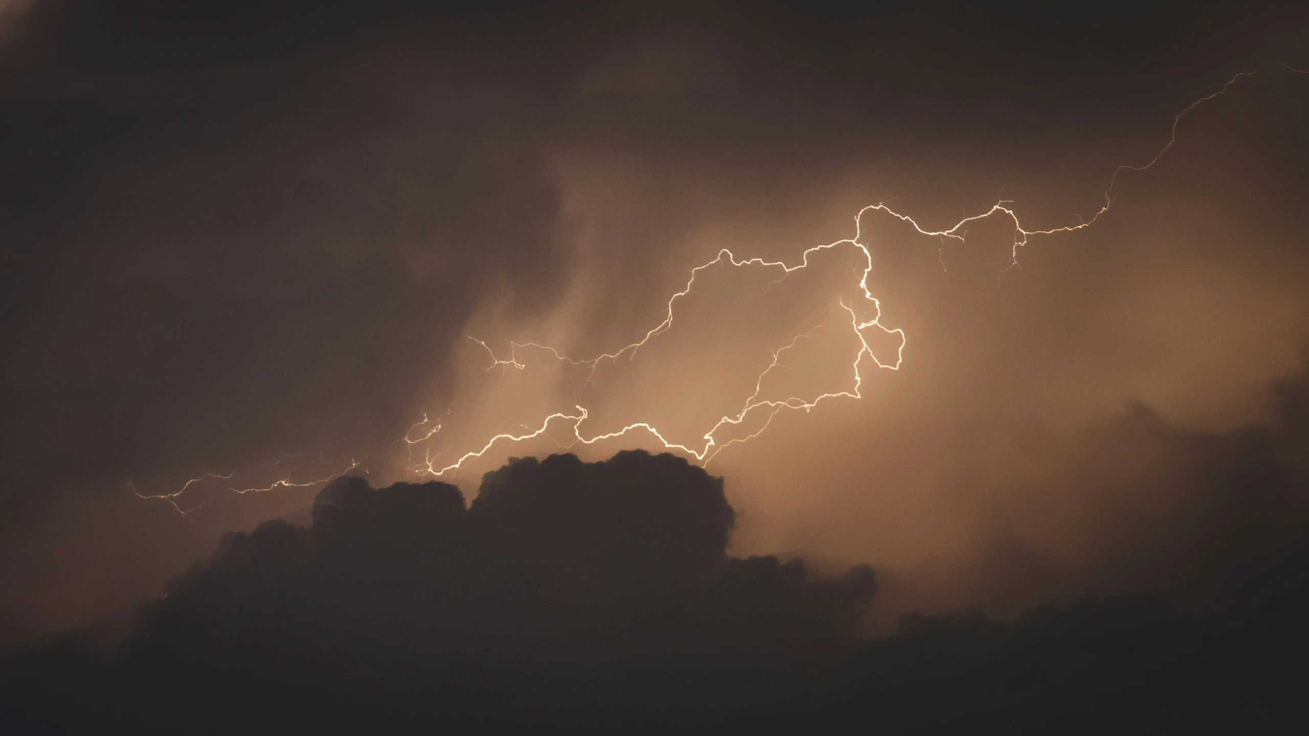 a thunder cloud filled with lots of lightning