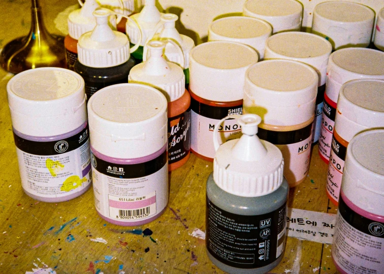 an array of crafting bottles with markers on them