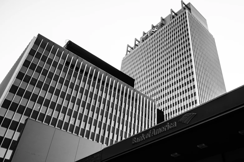 two office buildings, with black and white glass windows