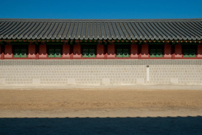 a picture of a building that looks like it has red shutters