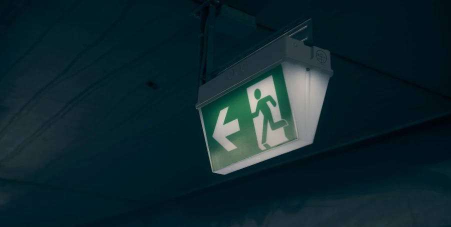 a pedestrian sign is seen on the ceiling of a building